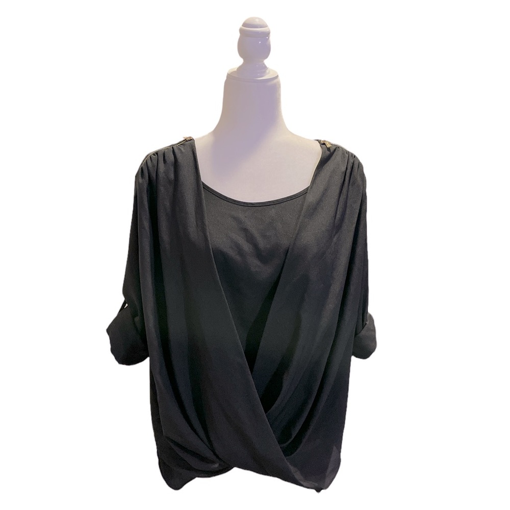 Calvin Klein blouse, adorned with gold zippers, draped in front